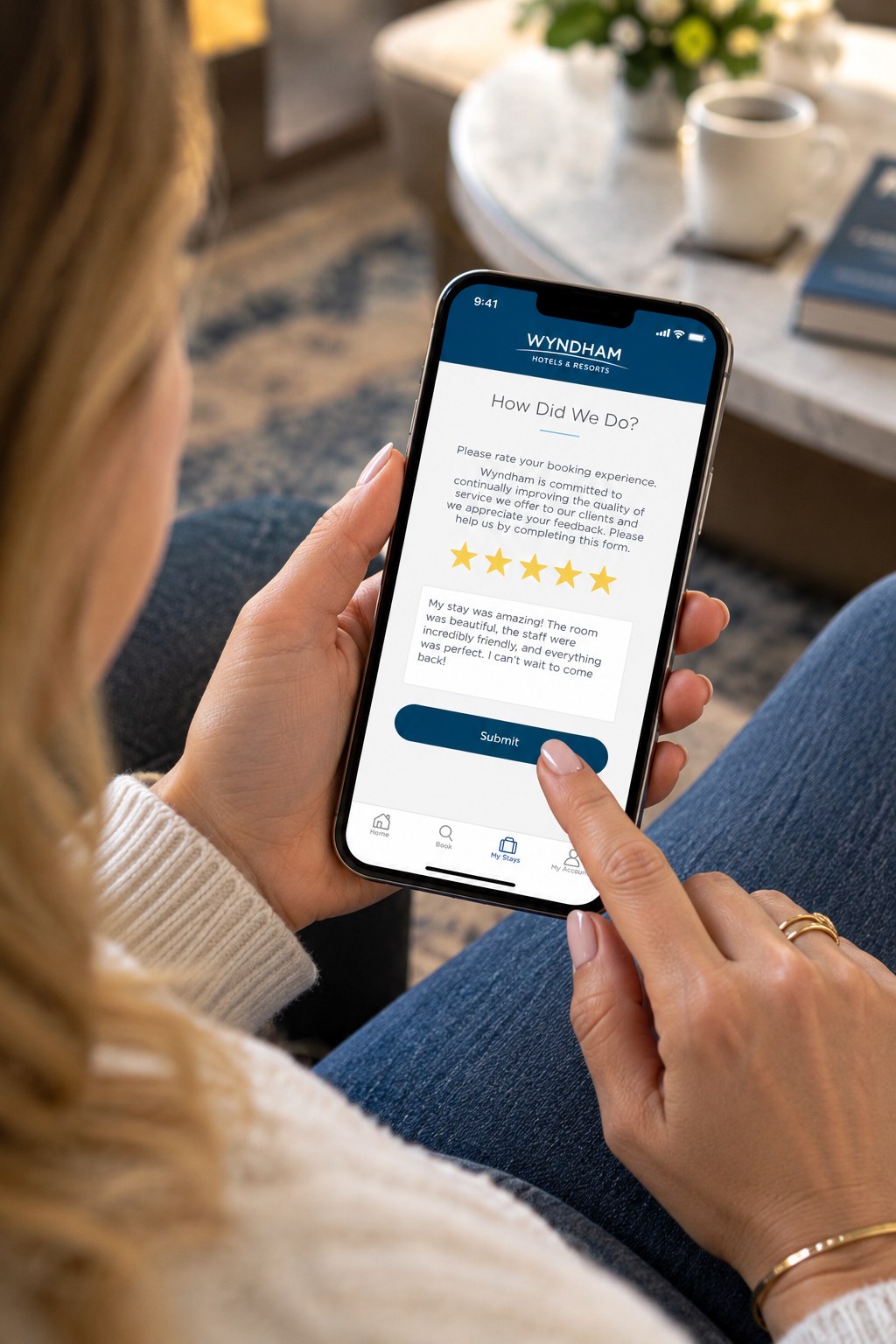 A guest submitting a five-star review on the Wyndham app's How Did We Do? feedback screen.